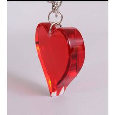 A gorgeous red Lucite heart is suspended from a silver tone metal chain. It can be worn as a necklace or a belt and it is in pristine condition. Measurements; Chain  Length 31" Heart  Length 3.5" Width 3" Depth 1" A Necklace, Metal Chain, Chain Lengths, Heart Necklace, Chain Length, Silver Tone, Chain, Canning, Silver