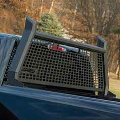 the back end of a blue pickup truck