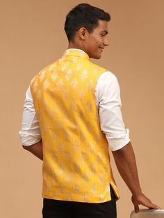 SHRESTHA By VASTRAMAY Men's Yellow Woven Flap Ethnic Jacket Add a touch of ethnic elegance to your wardrobe with this yellow woven flap jacket for men. Crafted with care, this jacket features a unique design that blends traditional style with modern sensibilities. Perfect for special occasions or casual outings, this jacket is sure to make you stand out in style. Features: Ethnic jacket for men Yellow color with woven flap design Blend of traditional and modern style Suitable for special occasio Traditional Yellow Nehru Jacket For Festivals, Traditional Yellow Outerwear For Fall, Fitted Yellow Nehru Jacket With Long Sleeves, Fitted Yellow Nehru Jacket, Yellow Long Sleeve Nehru Jacket For Festivals, Traditional Yellow Fall Outerwear, Fitted Yellow Nehru Jacket For Festivals, Modi Jacket For Men, Ethnic Jacket