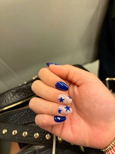 Blue nails with stars and rhinestones Navy Blue And Stars Nails, Blue With Stars Nails, Eras Tour Nails Midnight, Star Blue Nails, Blue Star Nails Acrylic, Blue Christmas Nails Acrylic, Blue And Black Nails Designs, Star Nails Blue, Blue Rhinestone Nails