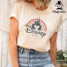 a woman with blonde hair wearing a disney shirt