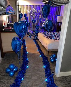 blue balloons and streamers are on the floor