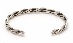 "Four round silver wires braided into a bracelet by Alene Tahe. Bracelet is 3/16"" wide and measures 5 1/8"" tip to tip with a variable opening of 1"" to 1 1/2"", fitting a wrist circumference of up to 6 3/8""." Adjustable Twisted Silver Bracelets, Silver Adjustable Twisted Bracelets, Classic Adjustable Braided Bangle Bracelet, Adjustable Braided Cuff Bracelet, Adjustable Braided Sterling Silver Bracelet, Adjustable Sterling Silver Bracelet With A Modern Twist, A Bracelet, Wire Bracelet, Silver Wire