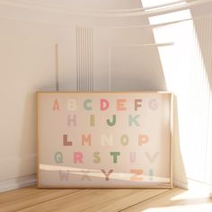 a wooden frame sitting on top of a hard wood floor next to a white wall