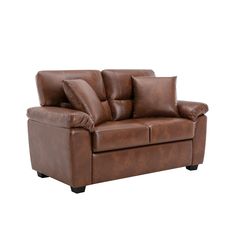 a brown leather couch with pillows on it's back and the seat upholstered