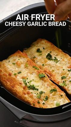 a close up of food in a pan with the words air fryer cheesy garlic bread