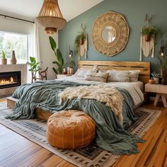 a bedroom with a large bed and fireplace in the corner, surrounded by potted plants