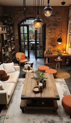 a living room filled with furniture and lots of bookshelves on top of it