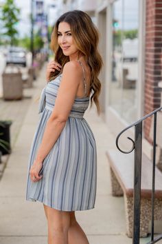 Stand out from the crowd in this super fun tank dress! The mixed stripes create a slimming effect and the tie front gives it that extra bit of character! Wear this on a hot sunny day or pair with a denim jacket, cardigan, or blazer on a cooler one! The possibilities are endless with how to style this for wherever the day takes you!Self & Lining: 100% PolyesterHand wash cold separately. Only non-chlorine bleach when needed. Flat dry. Warm iron if needed. Hot Sunny Day, Kimono Blouse, Romper And Jacket, Jacket Cardigan, Guest Attire, Wedding Attire Guest, Long Sleeve Short Dress, Loungewear Sets, Striped Tie