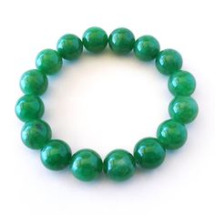 "Bright Green Jade 12mm Bead Stretch Bracelet. 16 beads total. Unstretched inside dimension 2\". Ancient Chinese culture has revered Jade for centuries. Jade is considered the health, wealth and longevity stone, which is found in different colors that can be used on the appropriate Chakra based on its particular color. Overall, Jade is a gentle natured stone, it is loving, soothing, caring, and uplifting. PLEASE NOTE: I can fit up to FOUR items in our Priority Mail Flat Rate envelope. Multiple p Cheap Hypoallergenic Green Stretch Bracelet, Cheap Green Beaded Jewelry, Green 8mm Beads Stretch Bracelet For Meditation, Spiritual Jade Stretch Bracelet With 8mm Beads, Green Round Beads Stretch Bracelet For Meditation, Jade Stretch Bracelet For Healing With Round Beads, Jade Stretch Bracelet With 8mm Beads, Jade Gemstone Beads Stretch Bracelet, Jade Stretch Bracelet With Gemstone Beads