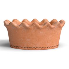 a clay crown is shown on a white background