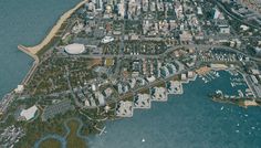 an aerial view of a large city by the water