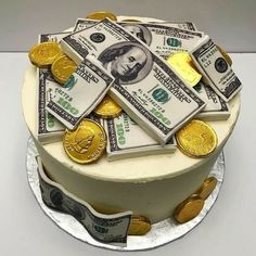 a cake decorated with money and gold coins