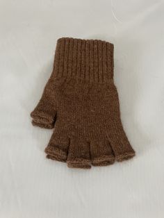 "Alpaca fleece fingerless gloves are a type of gloves made from the soft and warm fleece of an alpaca.  These gloves are designed to keep your hands warm while allowing your fingers to remain free, making them ideal for outdoor activities like hiking, camping, or skiing. The fingerless design also makes them great for tasks that require dexterity, such as typing or playing musical instruments.  Alpaca fleece is a luxurious and durable material that offers excellent insulation, making these glove Sun Fairy, Knitted Fingerless Gloves, Alpaca Fleece, Brown Gloves, Fairy Outfit, Texting Gloves, Fleece Gloves, Fingerless Gloves Knitted, Sports Gloves