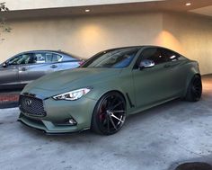 two cars parked next to each other in a garage