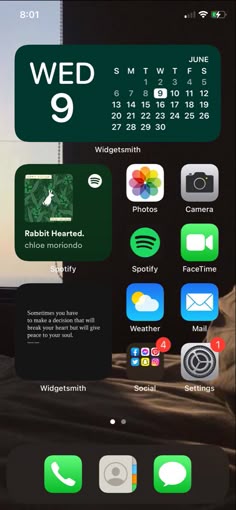 an iphone screen with the calendar on it and icons for different things in front of it