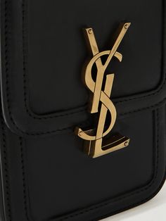 SAINT LAURENT's 'Solferino' bag upholds the house founder's legacy of elegance and craftsmanship. It's cut from smooth black leather and embellished with the iconic 'YSL' logo plaque on the front. The compact size is perfect for securing your everyday essentials. Mini Logos, Messenger Bag Men, Leather Messenger Bag, Leather Messenger, Everyday Essentials Products, Messenger Bag, Saint Laurent, Black Leather, ? Logo