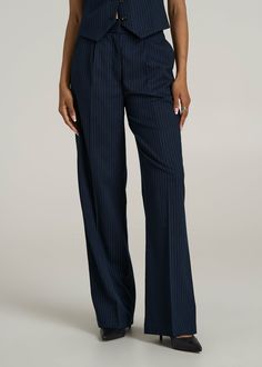 Elevate Every Occasion High-Rise Wide-Leg Pleated Dress Pants for Tall Women Add a hint of elegance with these High-Rise Wide-Leg Pleated Dress Pants, a must-have wardrobe staple for tall ladies. These women's tall pants marry the grace of a wide leg with the sophistication of pleats, ensuring you stand with style and confidence at any event. With a high rise that cinches your waist and a fluid drape that elongates your legs, these tall women's pants are a celebration of fashion and form.• Pleat Striped Wide Leg Formal Pants, Striped Wide Leg Pants For Formal Occasions, Formal Striped Wide Leg Pants, Elegant Striped Pants For Office, Elegant Striped Office Pants, Elegant Pinstripe Dress Pants, Elegant Straight Pants With Vertical Stripes, Striped Wide Leg Formal Bottoms, Striped Wide-leg Pants For Business Casual