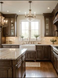 a large kitchen with wooden cabinets and marble counter tops, along with a chandelier hanging from the ceiling