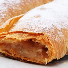 some type of pastry with powdered sugar on top