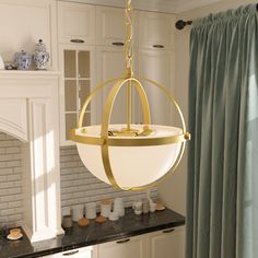 a light fixture hanging from the ceiling in a kitchen