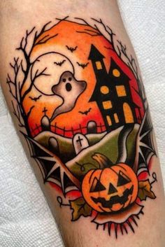 a halloween themed tattoo on the arm