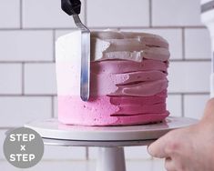 a person cutting a cake with a knife