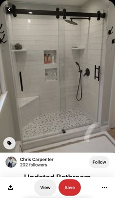 a bathroom with a walk in shower next to a toilet