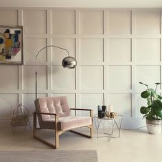 a living room filled with furniture and a large potted plant