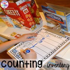 a child is doing counting in front of some cereal boxes