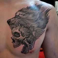 a man with a tattoo on his chest has a skull and wolf's head