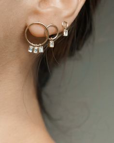 a close up of a person wearing some kind of earring on their left side