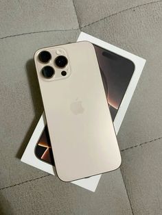 an iphone 11 is sitting on top of a white box next to it's packaging