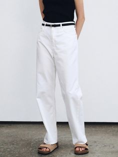 This product is a pair of light straight cotton pants, a quintessential wardrobe staple with a clean and minimalistic design. They are crafted to offer a comfortable straight fit, perfect for a relaxed yet polished look. The pants feature a mid-rise waist that sits naturally on the hips, providing a timeless silhouette suitable for various occasions. - Cut to offer a straight leg fit, these cotton pants provide both comfort and a classic style.- A mid-rise design ensures the pants rest comfortably at the hip, offering a versatile fit for different body types.- They are constructed with a lightweight cotton material, making them ideal for warmer climates or layering in cooler weather.- The pants maintain a sleek look with minimal detailing, emphasizing their adaptability and effortless White Straight Fit Pants With Five Pockets, Modern Cotton Pants For Everyday, Modern Everyday Cotton Pants, Modern Straight Fit Cotton Bottoms, White Chinos With Straight Hem For Spring, White Tapered Leg Chinos For Spring, White Straight Fit Jeans For Workwear, White Cotton Straight Fit Bottoms, White Straight Bottoms For Workwear