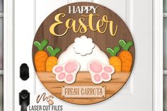 a happy easter door hanger with bunny feet and carrots