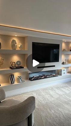 a living room filled with furniture and a flat screen tv mounted on a wall above a fireplace