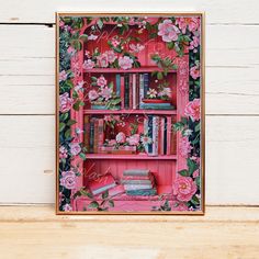 a pink book shelf with books and flowers painted on it