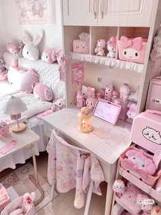 a room filled with lots of pink furniture and decor on top of white tables covered in hello kitty decorations