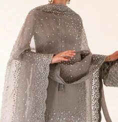 Description: An exceptionally curated raw silk short shirt intricately embellished with sequins, its paired with gray raw silk palazzo pants with organza dupatta embellished on all four sides beautifully. Its elegance is praiseworthy entirely. The color of the outfit may vary due to lighting effect use in photography Silk Palazzo Pants, Hussain Rehar, Plazo Pants, Traditional Suit, Punjabi Outfits, Desi Wear, Pakistani Fashion Party Wear, Short Shirt, Everyday Fashion Outfits