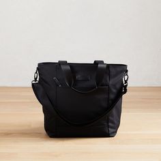 West Elm Classic Travel Tote - Medium | West Elm Black Diaper Bag With Adjustable Strap For Everyday Use, Black Shoulder Bag With Leather Handles For Commuting, Travel Tote Laptop Bag With Adjustable Handle, Functional Laptop Tote Bag With Adjustable Strap, Functional Laptop Tote With Adjustable Strap, Everyday Black Nylon Laptop Bag, Travel Nylon Diaper Bag With Adjustable Strap, Travel Diaper Bag With Adjustable Strap In Nylon, Travel Diaper Bag With Adjustable Strap And Nylon Material