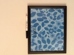 a blue and black framed artwork with the word june written on it