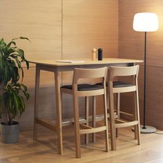 two stools and a table in a room