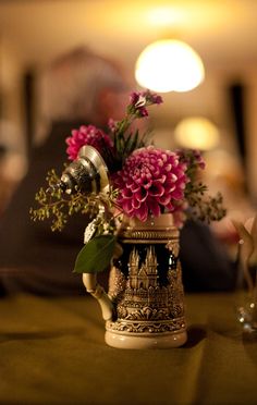 a vase filled with flowers sitting on top of a table