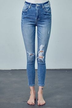 High Rise Ankle Skinny Jeans Embrace classic style with our High Rise Ankle Skinny Jeans. Crafted from a blend of cotton and spandex, these jeans offer a flattering high rise, a figure-hugging skinny fit, and a versatile ankle length. Perfect for a variety of looks. Key Features: High rise Skinny fit Ankle length Knee distress Stretch denim Details: Style: Casual Print/Pattern: Medium Silhouette: Skinny Fit: Skinny Embellishment: Knee Distress Length: Ankle-Length Closure: Button Closure Lining: Everyday Distressed Cropped Leg Bottoms, Everyday Distressed Cropped Bottoms, Everyday Ripped Cropped Leg Bottoms, Ripped Cropped Leg Bottoms For Everyday, Fitted High Rise Distressed Cropped Jeans, Mid-rise Distressed Bottoms For Fall, Fitted High-rise Distressed Cropped Jeans, Distressed High Rise Jeggings, Ripped Mid-rise Bottoms For Fall