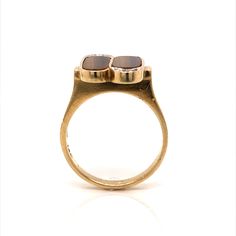 This striking Mid-Century statement ring features tiger’s eye quartz and Round Brilliant accent diamonds in 14 karat yellow gold. The tiger’s eyes showcase a chocolatey brown hue. Set in two twin bezels, the cabochon cut tiger’s eyes are accented by four (4) diamonds on the top and bottom of the stones. Set on a flat profile 14K yellow gold band, this vintage ring is perfect for everyday wear. Fine Jewelry 14k Gold Brown Ring, Brown 14k Gold Fine Jewelry Ring, Brown 14k Gold Rings Fine Jewelry, Formal Brown 14k Gold Rings, Luxury Brown Formal Rings, Modern Brown Rings For Anniversary, Formal Brown Rings With Polished Finish, Modern Brown Anniversary Ring, Modern Brown Ring For Formal Occasions