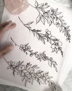 someone is drawing flowers and leaves on a piece of paper with the words, how to draw