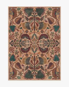 an intricately designed rug with leaves and flowers