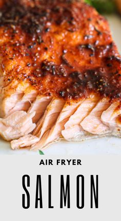 salmon fillets on a white plate with text overlay that reads air fryer salmon