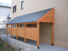 a large wooden building with a metal roof