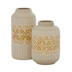 two vases with designs on them sitting next to each other in front of a white background